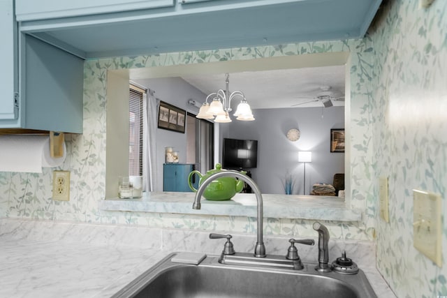 614 15th Ave S Unit 41, Surfside Beach, SC 29575 - kitchen with a chandelier, ceiling fan, and wallpapered walls