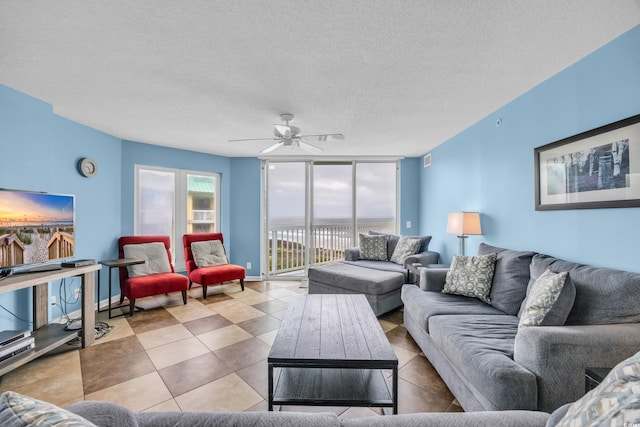 135 S Dunes Dr Unit 501, Pawleys Island, SC 29585 - living area with a ceiling fan and a textured ceiling