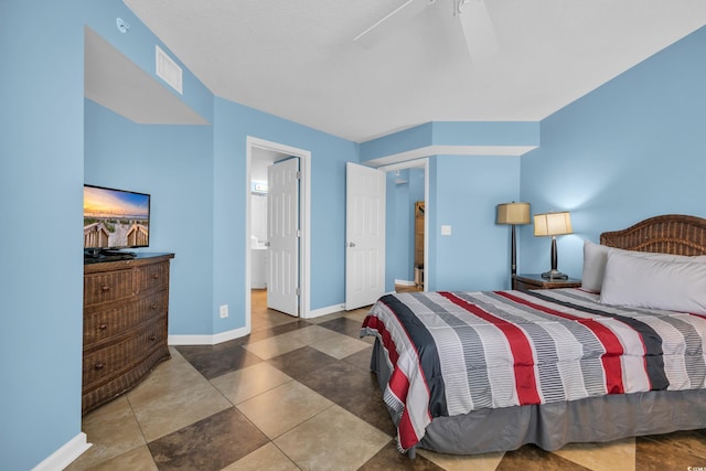 135 S Dunes Dr Unit 501, Pawleys Island, SC 29585 - bedroom with baseboards and ensuite bath