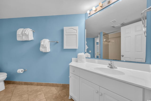 135 S Dunes Dr Unit 501, Pawleys Island, SC 29585 - full bathroom featuring vanity, toilet, baseboards, and tile patterned flooring