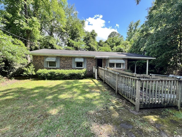 41 Harmon St, Hemingway, SC 29554 - view of front facade featuring a front yard and brick siding