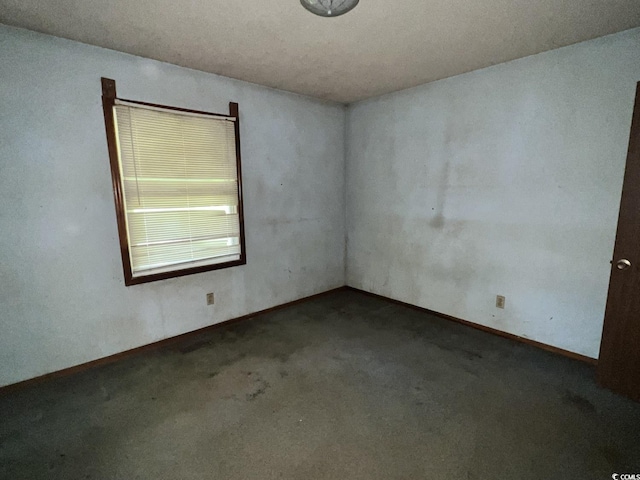 41 Harmon St, Hemingway, SC 29554 - empty room featuring carpet flooring and baseboards