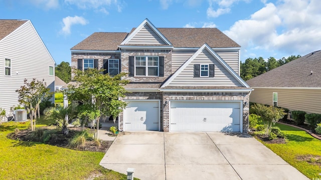 5621 Camilla Ct, Myrtle Beach, SC 29579 - view of front of home with driveway, a garage, central AC, and a front lawn