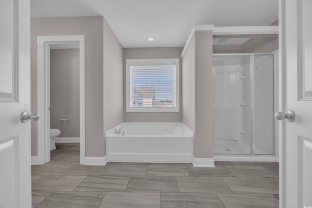 5621 Camilla Ct, Myrtle Beach, SC 29579 - full bathroom featuring a garden tub, a shower stall, toilet, and baseboards