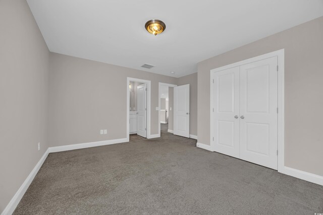 5621 Camilla Ct, Myrtle Beach, SC 29579 - unfurnished bedroom with carpet floors, baseboards, a closet, and ensuite bath