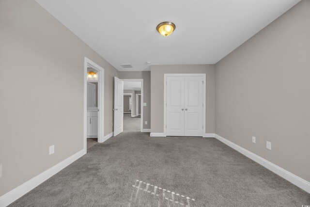 5621 Camilla Ct, Myrtle Beach, SC 29579 - unfurnished bedroom with carpet, baseboards, and a closet