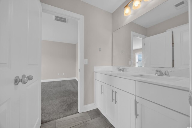 5621 Camilla Ct, Myrtle Beach, SC 29579 - bathroom with double vanity and baseboards
