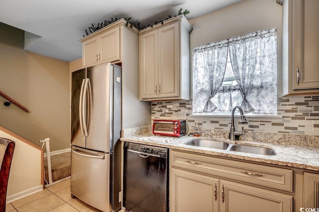 403 Chesterfield Ct, Myrtle Beach, SC 29577 - kitchen with black dishwasher, freestanding refrigerator, cream cabinetry, and a sink