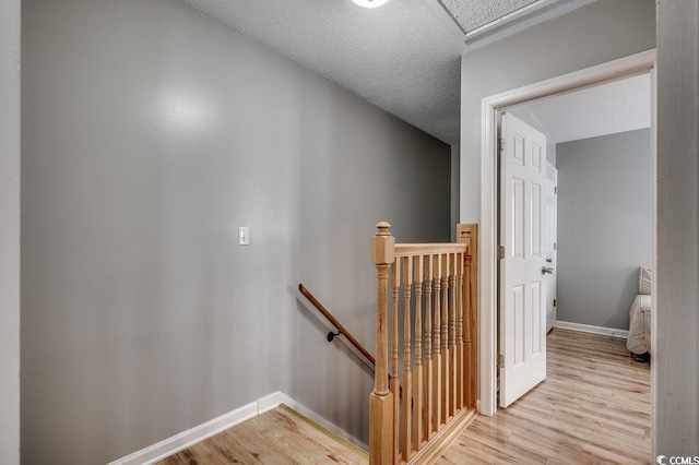403 Chesterfield Ct, Myrtle Beach, SC 29577 - stairs featuring wood finished floors, baseboards, a textured ceiling, and attic access
