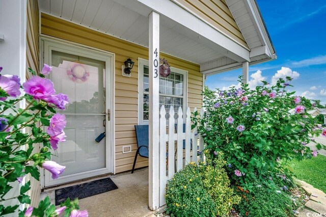 403 Chesterfield Ct, Myrtle Beach, SC 29577 - property entrance with a porch