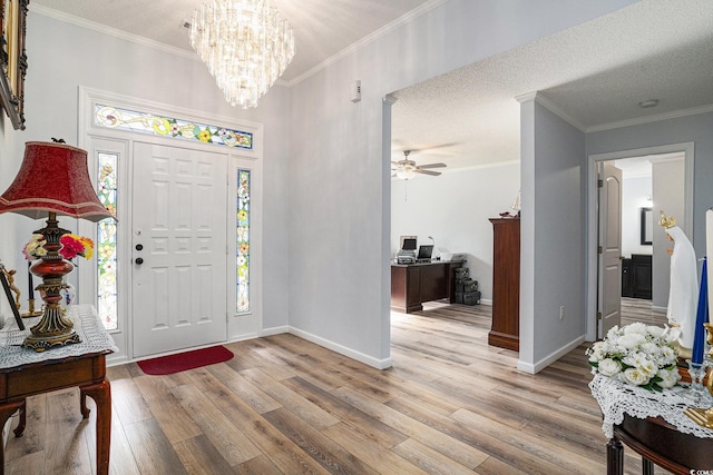 2981 Victor Rd, Longs, SC 29568 - foyer featuring light wood-style floors, a chandelier, baseboards, and ornamental molding
