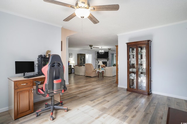 2981 Victor Rd, Longs, SC 29568 - office area featuring ceiling fan, light wood-style floors, crown molding, healthy amount of natural light, and a fireplace