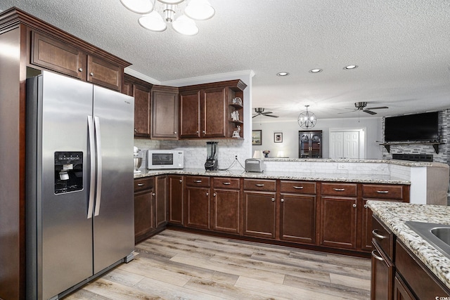 2981 Victor Rd, Longs, SC 29568 - kitchen featuring stainless steel fridge, ceiling fan, a chandelier, a peninsula, and a textured ceiling