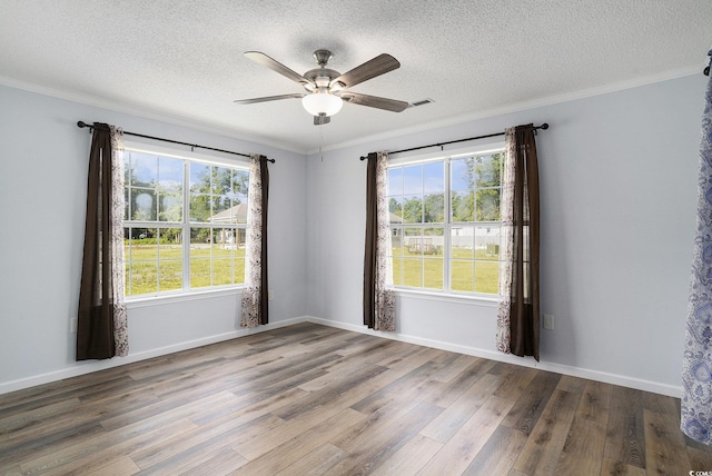 2981 Victor Rd, Longs, SC 29568 - unfurnished room with wood finished floors, healthy amount of natural light, a ceiling fan, ornamental molding, and a textured ceiling