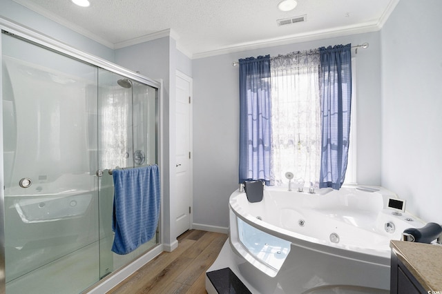 2981 Victor Rd, Longs, SC 29568 - bathroom with ornamental molding, wood finished floors, a shower stall, a whirlpool tub, and vanity
