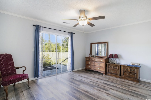 2981 Victor Rd, Longs, SC 29568 - sitting room featuring wood finished floors, a ceiling fan, ornamental molding, a textured ceiling, and baseboards