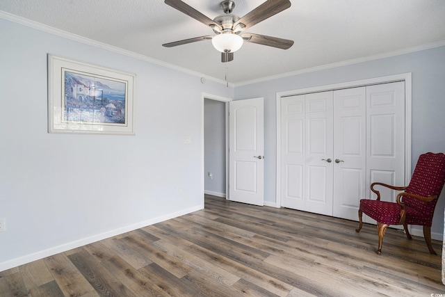 2981 Victor Rd, Longs, SC 29568 - bedroom featuring wood finished floors, crown molding, a closet, ceiling fan, and baseboards