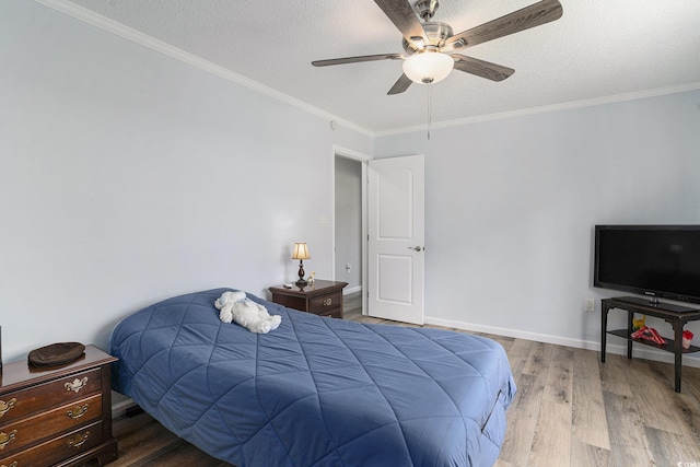 2981 Victor Rd, Longs, SC 29568 - bedroom featuring wood finished floors, ornamental molding, a textured ceiling, ceiling fan, and baseboards