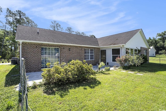 2981 Victor Rd, Longs, SC 29568 - back of property featuring a patio, brick siding, a shingled roof, and central air condition unit