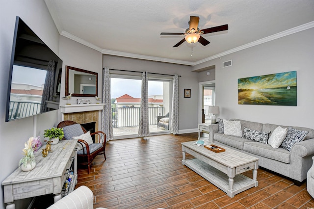 8121 Amalfi Pl Unit 7-805, Myrtle Beach, SC 29572 - living area featuring ceiling fan, wood finished floors, ornamental molding, baseboards, and a tiled fireplace