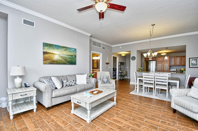 8121 Amalfi Pl Unit 7-805, Myrtle Beach, SC 29572 - living room featuring ceiling fan, a chandelier, crown molding, light wood-style flooring, and baseboards