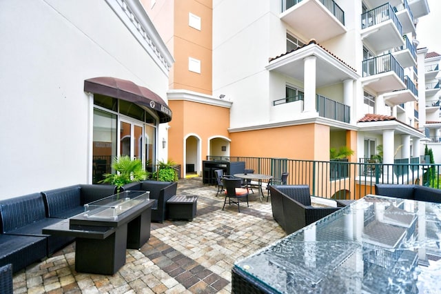 8121 Amalfi Pl Unit 7-805, Myrtle Beach, SC 29572 - view of patio featuring outdoor dining area and an outdoor hangout area