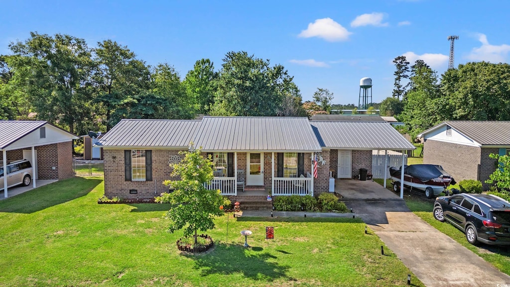 517 Cardinal Dr, Conway, SC 29526 - ranch-style home with concrete driveway, brick siding, covered porch, and metal roof