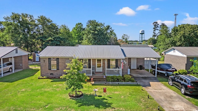 517 Cardinal Dr, Conway, SC 29526 - ranch-style home with concrete driveway, brick siding, covered porch, and metal roof