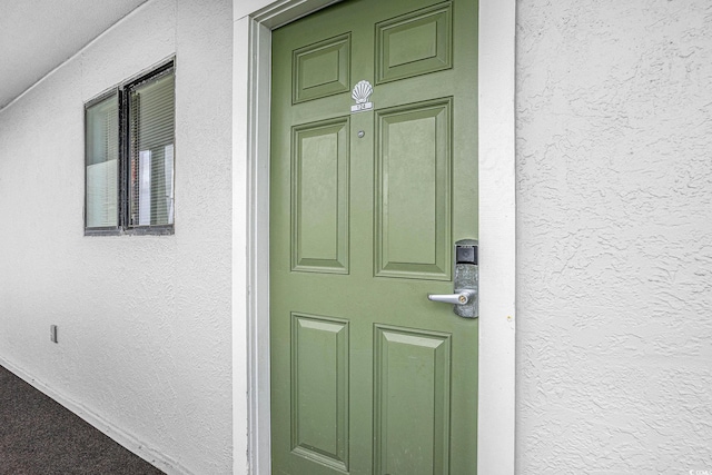 9400 Shore Dr Unit 124, Myrtle Beach, SC 29572 - view of exterior entry featuring stucco siding
