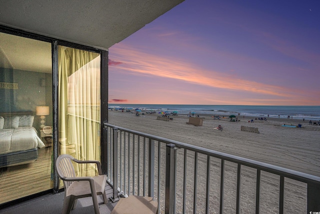 9400 Shore Dr Unit 124, Myrtle Beach, SC 29572 - balcony featuring view of water and beach