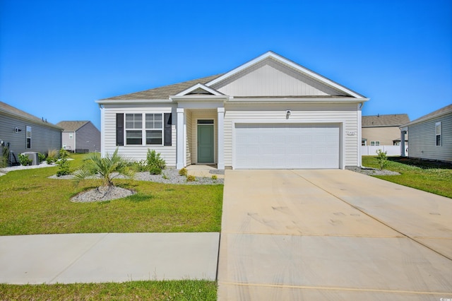 1723 Perthshire Loop, Myrtle Beach, SC 29579 - view of front facade featuring a front yard, a garage, driveway, and central AC unit