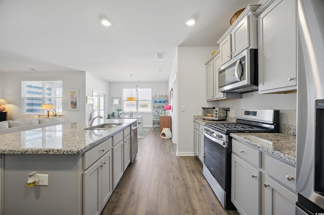 1723 Perthshire Loop, Myrtle Beach, SC 29579 - kitchen featuring appliances with stainless steel finishes, a sink, gray cabinetry, open floor plan, and recessed lighting