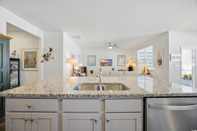 1723 Perthshire Loop, Myrtle Beach, SC 29579 - kitchen with dishwasher, a sink, ceiling fan, open floor plan, and light stone countertops