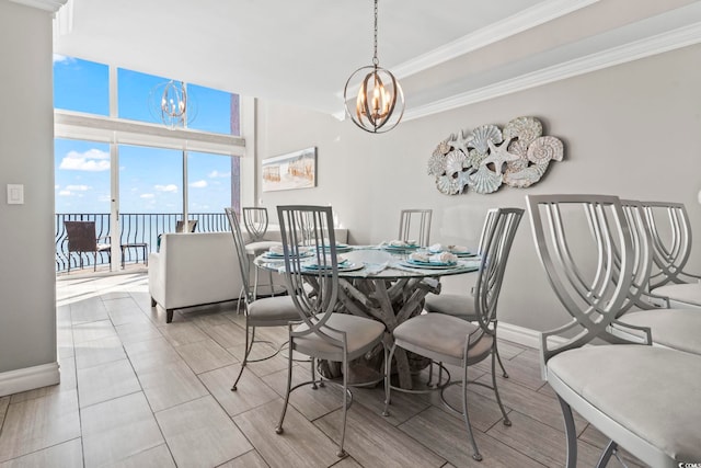 2500 N Ocean Blvd Ph 1, Myrtle Beach, SC 29577 - dining room with a chandelier, baseboards, ornamental molding, and a water view