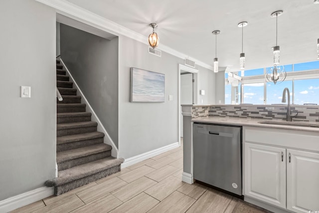 2500 N Ocean Blvd Ph 1, Myrtle Beach, SC 29577 - kitchen with dishwasher, a sink, white cabinets, light countertops, and decorative backsplash