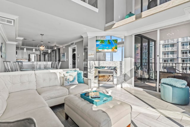 2500 N Ocean Blvd Ph 1, Myrtle Beach, SC 29577 - living room with crown molding and a chandelier