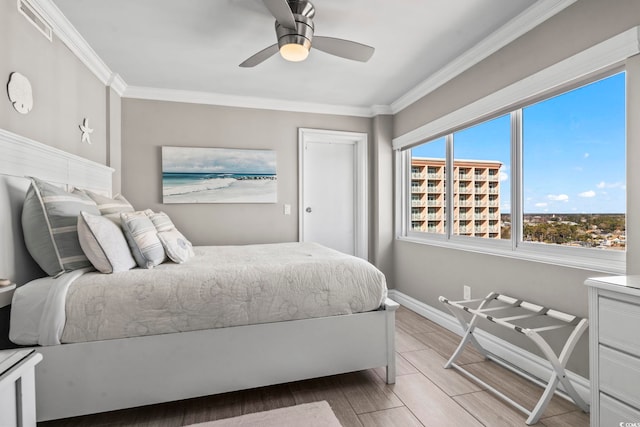 2500 N Ocean Blvd Ph 1, Myrtle Beach, SC 29577 - bedroom with crown molding, a ceiling fan, baseboards, and light wood-style floors