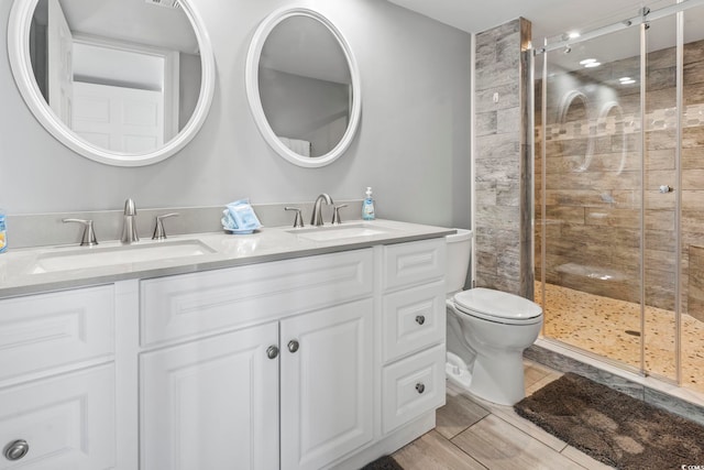 2500 N Ocean Blvd Ph 1, Myrtle Beach, SC 29577 - full bath with double vanity, a shower stall, and toilet