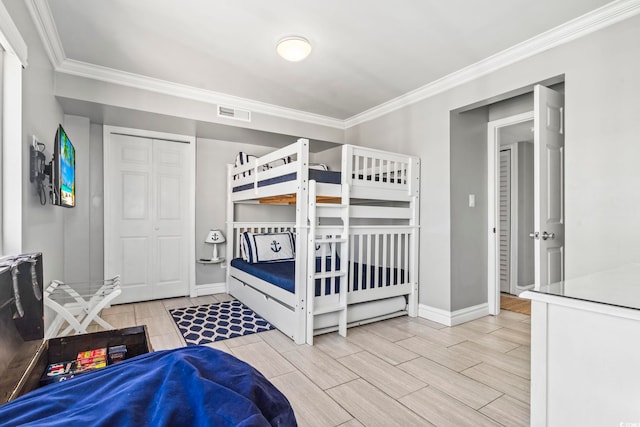 2500 N Ocean Blvd Ph 1, Myrtle Beach, SC 29577 - bedroom featuring crown molding, baseboards, wood tiled floors, and a closet