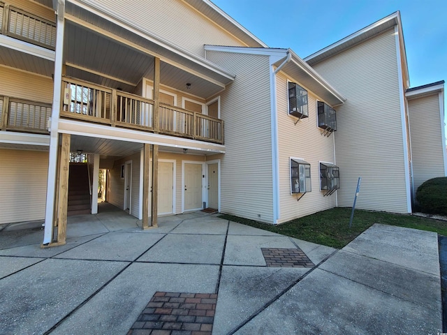 1025 W Plantation Dr W Unit 2817, Little River, SC 29566 - rear view of house featuring a balcony