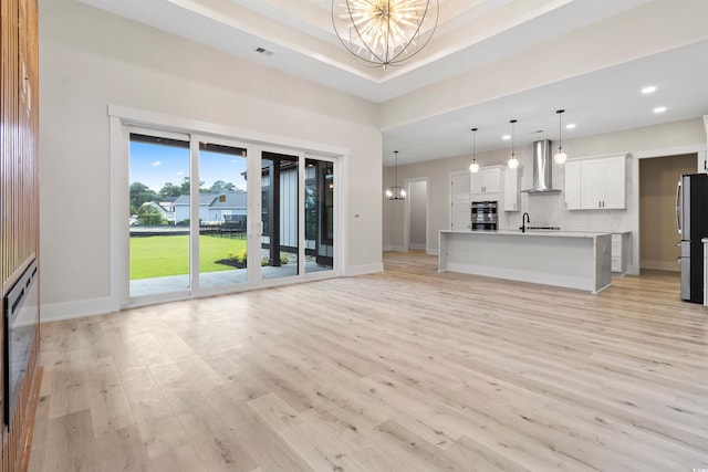 2205 Yellow Morel Way, Myrtle Beach, SC 29579 - unfurnished living room with a chandelier, baseboards, light wood-type flooring, and recessed lighting