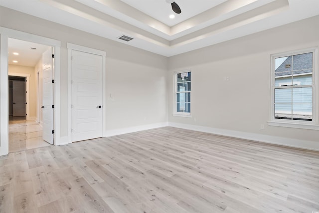 2205 Yellow Morel Way, Myrtle Beach, SC 29579 - spare room with light wood-type flooring, a tray ceiling, healthy amount of natural light, baseboards, and recessed lighting