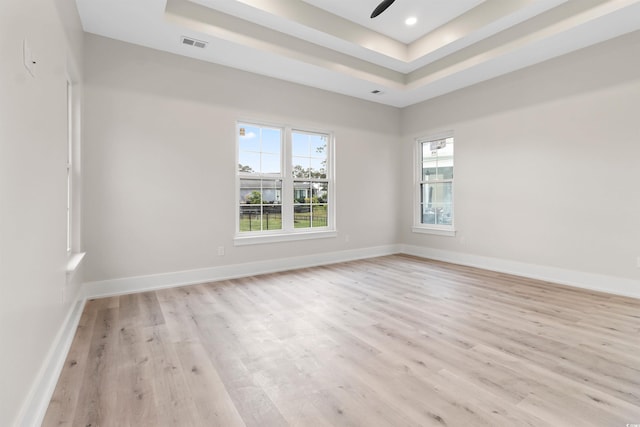 2205 Yellow Morel Way, Myrtle Beach, SC 29579 - empty room featuring plenty of natural light, a raised ceiling, light wood finished floors, ceiling fan, and recessed lighting