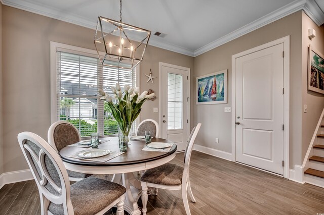 620 Lorenzo Dr Unit 620, North Myrtle Beach, SC 29582 - dining area with baseboards, wood finished floors, a chandelier, plenty of natural light, and crown molding