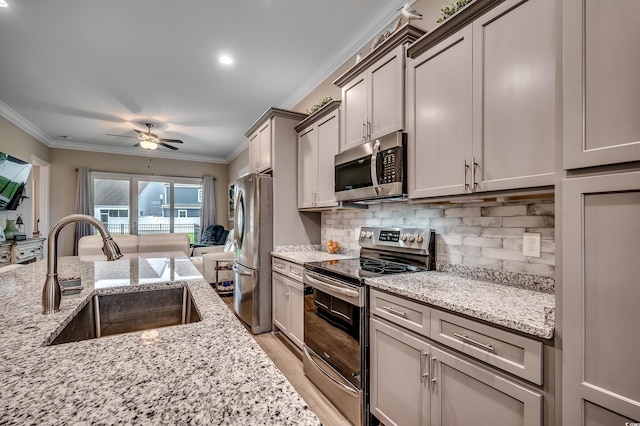620 Lorenzo Dr Unit 620, North Myrtle Beach, SC 29582 - kitchen featuring stainless steel appliances, a sink, crown molding, a ceiling fan, and backsplash