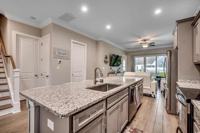 620 Lorenzo Dr Unit 620, North Myrtle Beach, SC 29582 - kitchen with a sink, stainless steel appliances, light wood-style floors, ceiling fan, and crown molding