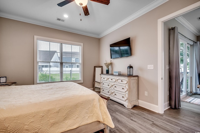 620 Lorenzo Dr Unit 620, North Myrtle Beach, SC 29582 - bedroom featuring crown molding, multiple windows, light wood-type flooring, baseboards, and ceiling fan