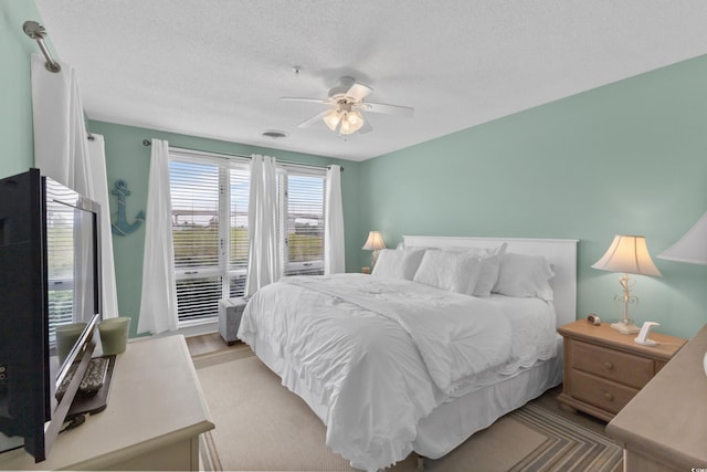 222 Landing Rd Unit 1811, North Myrtle Beach, SC 29582 - bedroom with ceiling fan and a textured ceiling