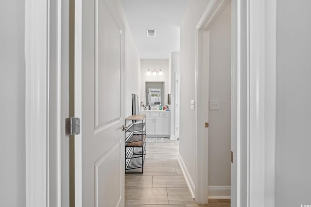 462 Pacific Commons Dr, Surfside Beach, SC 29575 - hallway with light wood-type flooring and baseboards