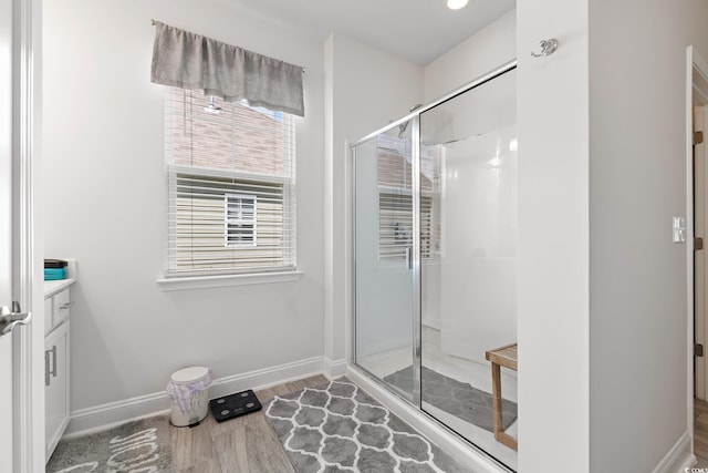 462 Pacific Commons Dr, Surfside Beach, SC 29575 - bathroom with a stall shower, vanity, baseboards, and wood finished floors